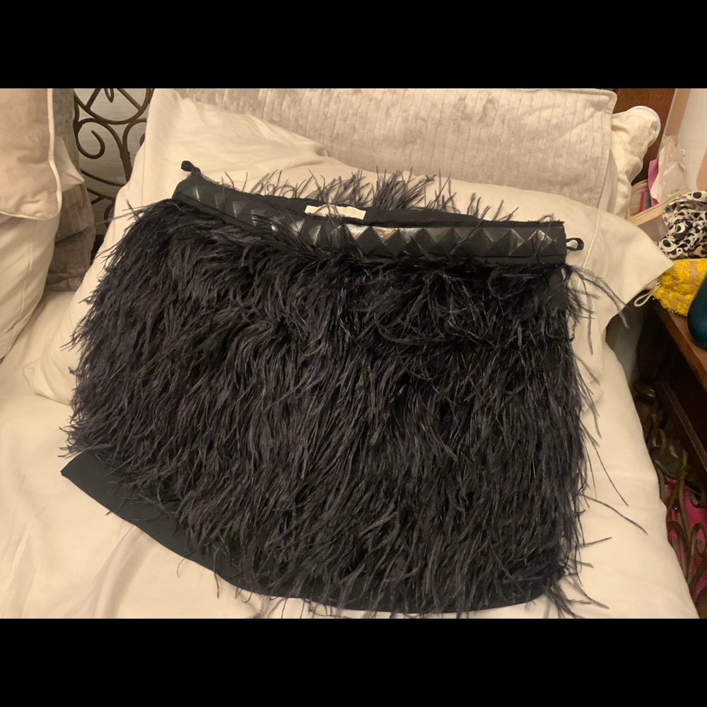 Brand new gorgeous black feathered mini skirt with side zipper.